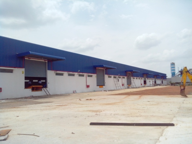 Warehouse construction Chennai - industrial warehouse exterior by Somappaa Infraa