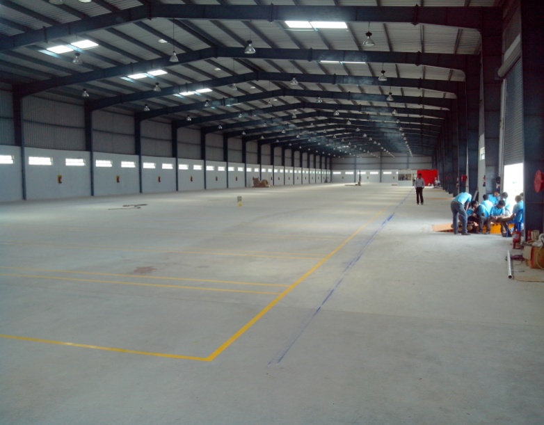 Factory building contractor near me - industrial warehouse interior with steel structure